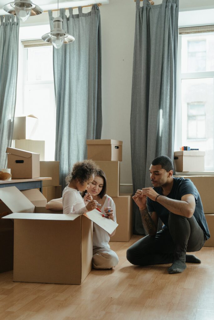 family moving with boxes